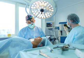 Man surgeon at work in operating room