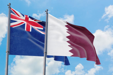 Qatar and Anguilla flags waving in the wind against white cloudy blue sky together. Diplomacy concept, international relations.