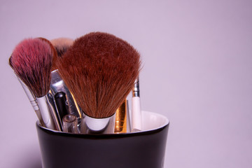makeup brush in cup
