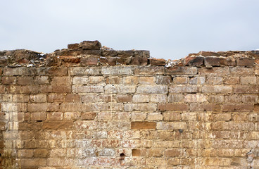 Fragment of wall in ruins of old manor. Element for design. Antique background.