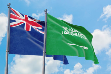 Saudi Arabia and Anguilla flags waving in the wind against white cloudy blue sky together. Diplomacy concept, international relations.