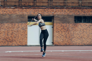Female javelin thrower training