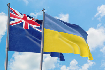 Ukraine and Anguilla flags waving in the wind against white cloudy blue sky together. Diplomacy concept, international relations.
