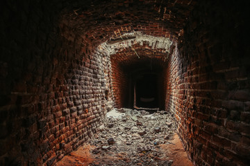 Historical underground red brick passage.