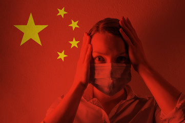 Girl in a mask against the background of the Chinese flag. Coronavirus, danger of disease, new...