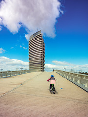 Torre del agua Expo 2008, Zaragoza, Spain, girl riding a bike to the tower