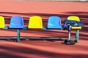Row of colorful stadium seats and sportsman's clothes