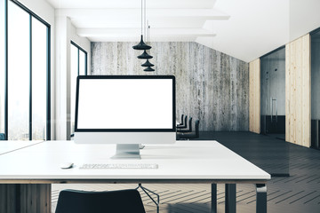 Designer desktop with blank computer screen