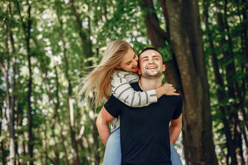Fototapeta premium Couple in a forest, warm summer, lovely weather