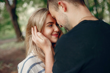 Obraz premium Couple in a forest, warm summer, lovely weather
