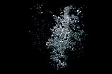 Beautiful gray water waves splashing in clean water on the black background