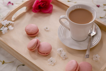 White Tea Cup on a Serving Tray with Pink Flowers and Cookies