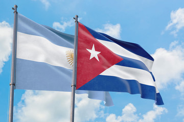Cuba and Argentina flags waving in the wind against white cloudy blue sky together. Diplomacy concept, international relations.