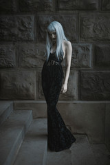 Dark gothic beautiful lady standing outdoor