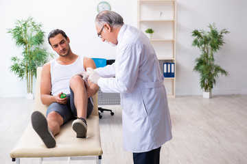 Young male patient visiting experienced doctor