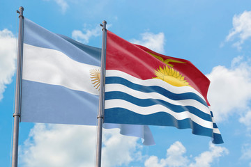 Kiribati and Argentina flags waving in the wind against white cloudy blue sky together. Diplomacy concept, international relations.