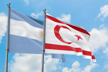 Northern Cyprus and Argentina flags waving in the wind against white cloudy blue sky together. Diplomacy concept, international relations.