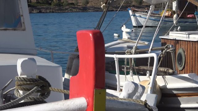 Close up of some fishing boats that are anchored at the port