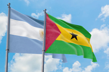 Sao Tome And Principe and Argentina flags waving in the wind against white cloudy blue sky...