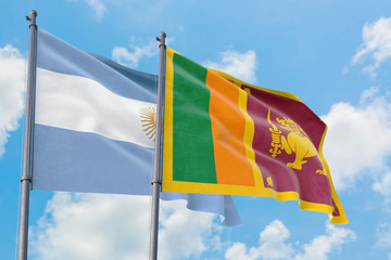 Sri Lanka and Argentina flags waving in the wind against white cloudy blue sky together. Diplomacy concept, international relations.