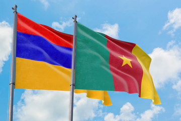 Cameroon and Armenia flags waving in the wind against white cloudy blue sky together. Diplomacy concept, international relations.