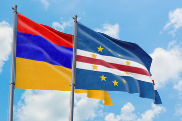 Cape Verde and Armenia flags waving in the wind against white cloudy blue sky together. Diplomacy concept, international relations.