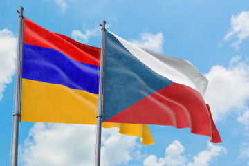 Czech Republic and Armenia flags waving in the wind against white cloudy blue sky together. Diplomacy concept, international relations.