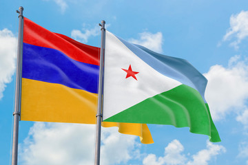 Djibouti and Armenia flags waving in the wind against white cloudy blue sky together. Diplomacy concept, international relations.