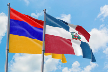 Fototapeta na wymiar Dominican Republic and Armenia flags waving in the wind against white cloudy blue sky together. Diplomacy concept, international relations.