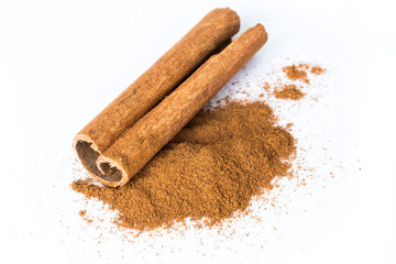 Cinnamon spice as bark stick and ground powder. Isolated on white background