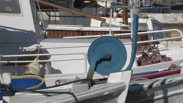 Close up of some fishing boats that are anchored at the port