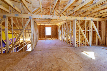 Fototapeta na wymiar House attic under construction walls and ceiling material in wooden frame