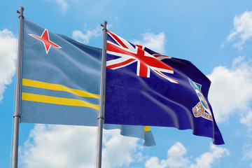 Falkland Islands and Aruba flags waving in the wind against white cloudy blue sky together. Diplomacy concept, international relations.