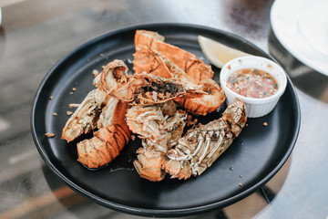 Grilled tiger shrimps on grill with spiced and lemon.Skewers Barbecue grilled prawns with spicy ingredients garlic with seafood