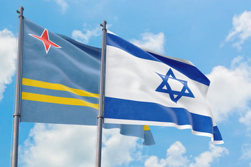 Israel and Aruba flags waving in the wind against white cloudy blue sky together. Diplomacy concept, international relations.
