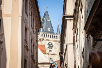 Fototapeta na wymiar Clock tower of Old Town Hall, a major landmark of Prague, Czech Republic, also called staromestska radnice, surrounded by medieval buildings of the stare mesto district