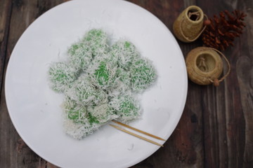 Klepon or Kelepon is a typical Indonesian snacks that come from Java. food made from glutinous rice flour which is formed by small balls plus brown sugar in it and sprinkled with grated coconut