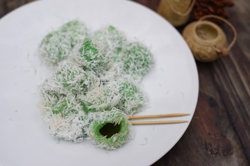 Klepon or Kelepon is a typical Indonesian snacks that come from Java. food made from glutinous rice flour which is formed by small balls plus brown sugar in it and sprinkled with grated coconut
