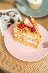 Delicious piece of cake on a plate in a cafe
