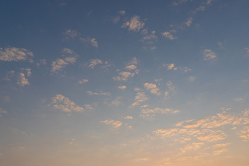 Clouds on blue-orange morning sky.