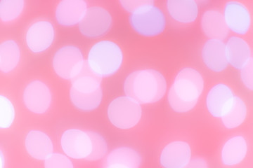 Blurred bokeh on pink background.