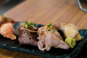 Set of sushi wagyu beef on black tray