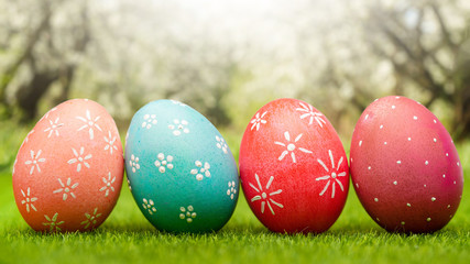 Easter painted eggs on green grass, spring easter composition
