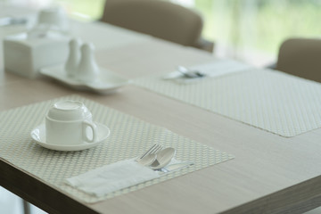 Coffee cup on wooden table for the freshness in coffee shop