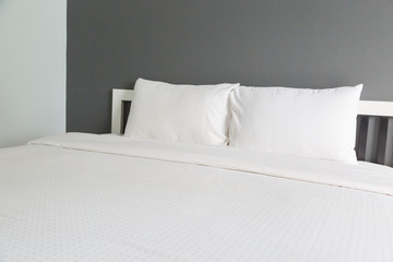 Fototapeta na wymiar Two white pillow on bed and blanket