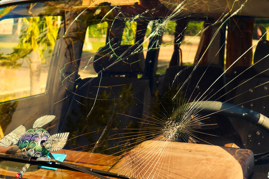 Cracked Car Windshield Of A Stylish MiniBus In The Tropical Light Of Mexico