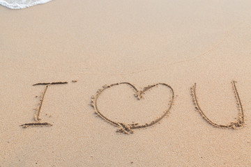 Message i love you on the sand beach