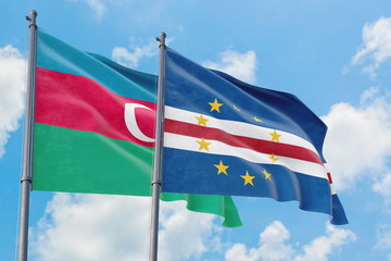 Cape Verde and Azerbaijan flags waving in the wind against white cloudy blue sky together. Diplomacy concept, international relations.