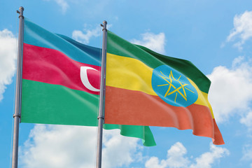Ethiopia and Azerbaijan flags waving in the wind against white cloudy blue sky together. Diplomacy concept, international relations.