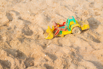 Colourful Toy car on the sand beach